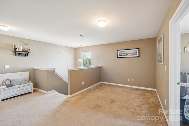 living area featuring light colored carpet