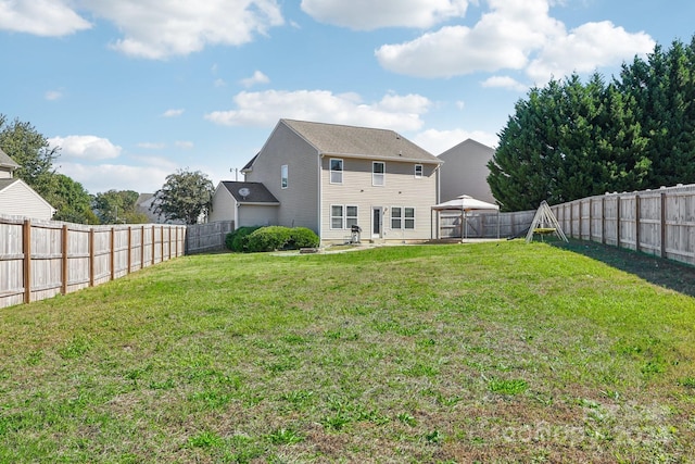 back of property featuring a patio and a yard