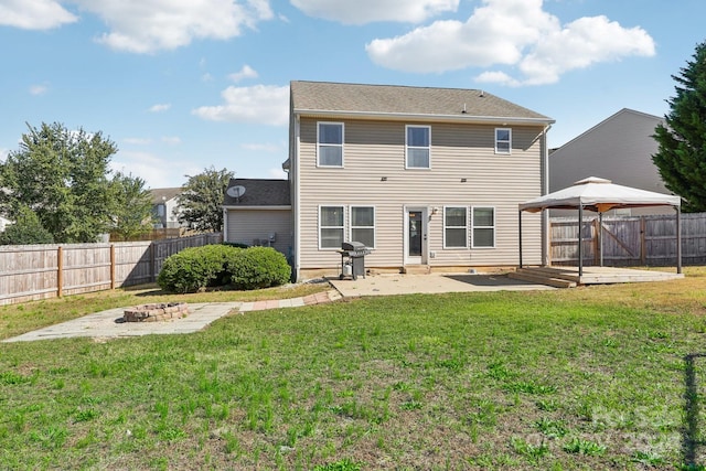 back of house featuring a gazebo, a patio area, a yard, and a wooden deck