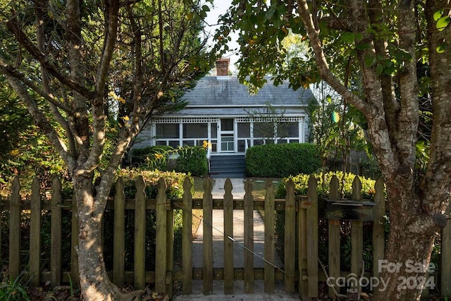 view of front of property with a sunroom