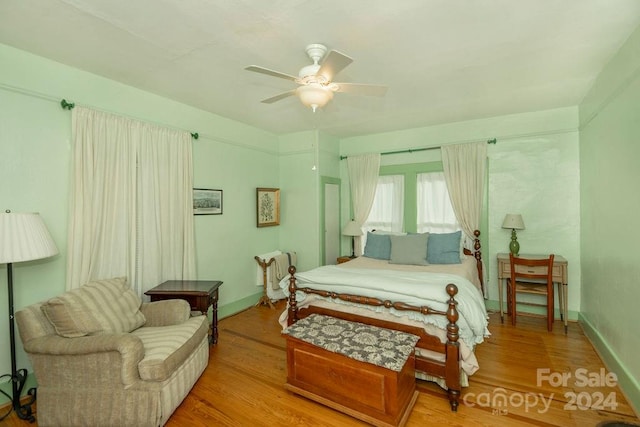 bedroom featuring ceiling fan and light hardwood / wood-style flooring