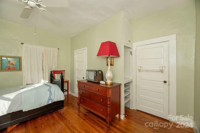 bedroom featuring ceiling fan and hardwood / wood-style flooring