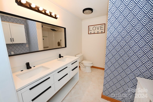 bathroom with vanity, tile patterned flooring, and toilet