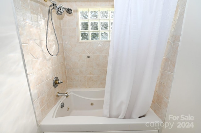 bathroom featuring shower / tub combo with curtain