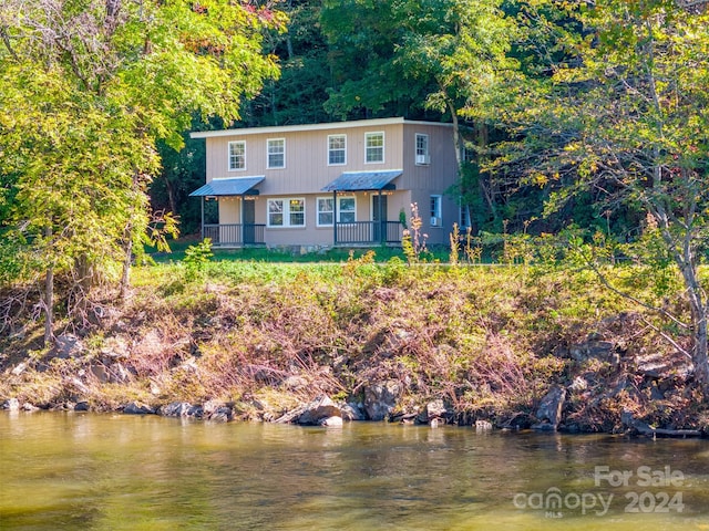 view of front of house featuring a water view