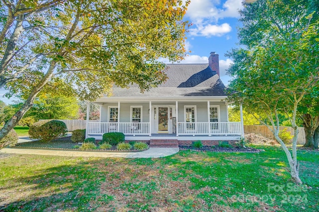 view of front of house featuring a front yard and a porch