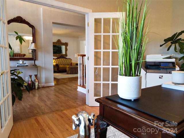 interior space with french doors and wood-type flooring