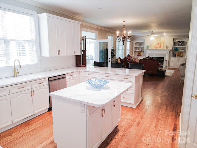 kitchen with white cabinets, dishwasher, and a center island