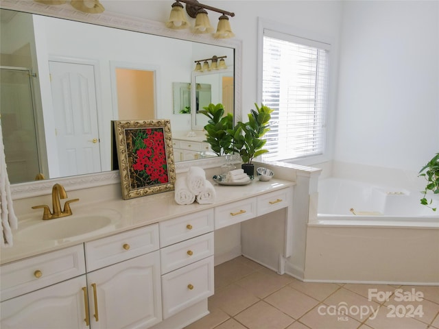 bathroom with tile patterned flooring, vanity, and separate shower and tub