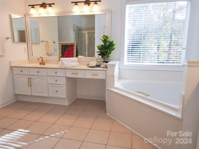 bathroom featuring tile patterned floors, vanity, and independent shower and bath