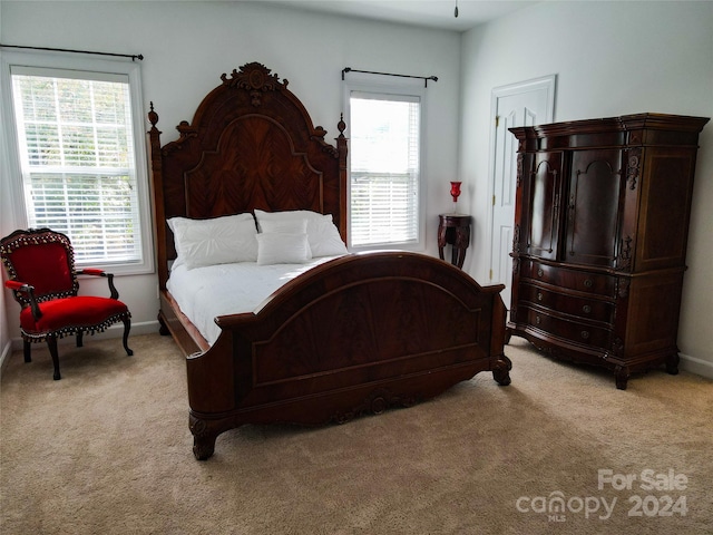 bedroom with light carpet