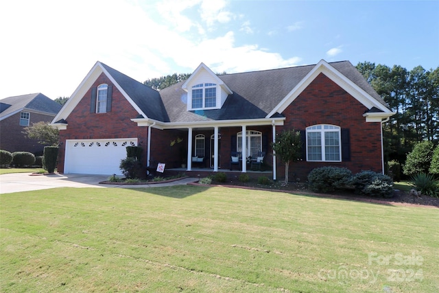 view of front of home with a garage and a front lawn