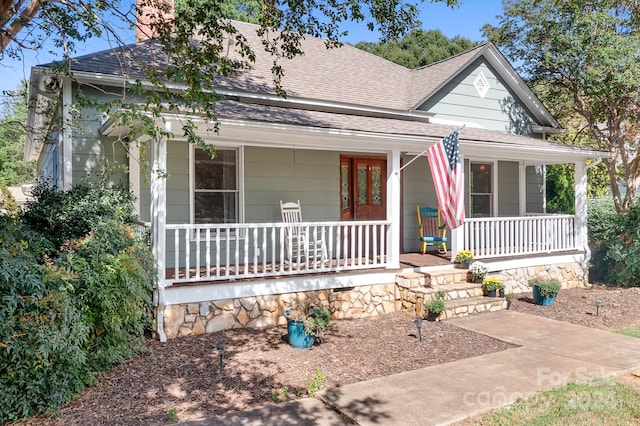 country-style home with covered porch