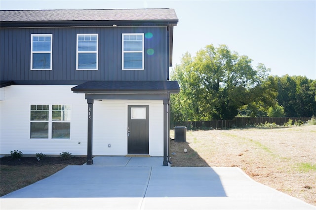 view of front of house featuring a patio area and central air condition unit