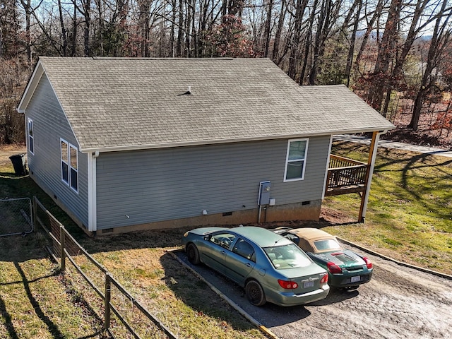 view of property exterior featuring a lawn