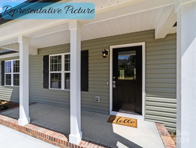 property entrance with covered porch