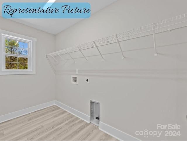 washroom with washer hookup, light wood-type flooring, and electric dryer hookup