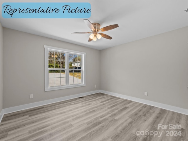 spare room featuring ceiling fan and light hardwood / wood-style floors