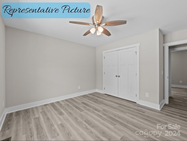 unfurnished bedroom with ceiling fan, a closet, and light hardwood / wood-style flooring