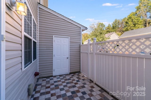 view of patio featuring fence