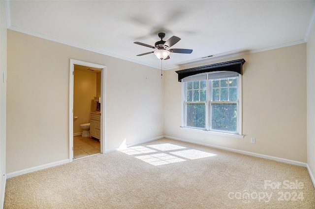 carpeted empty room featuring ceiling fan and ornamental molding