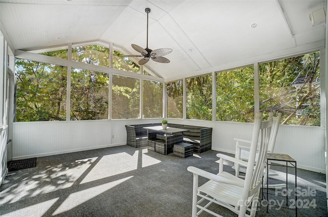 sunroom with ceiling fan and lofted ceiling