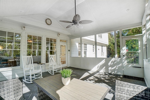 sunroom featuring lofted ceiling, plenty of natural light, and ceiling fan