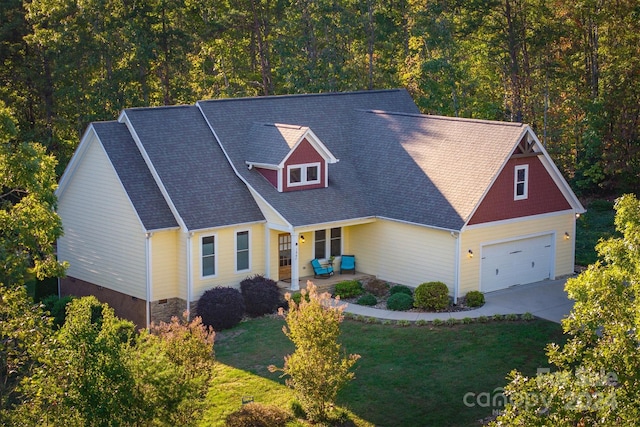 view of front facade with a garage and a front lawn