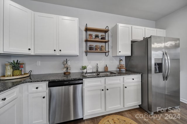 kitchen featuring sink, white cabinetry, dark wood-type flooring, and stainless steel appliances