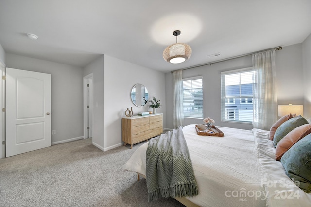 bedroom with light colored carpet