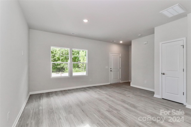 unfurnished room featuring light wood-type flooring