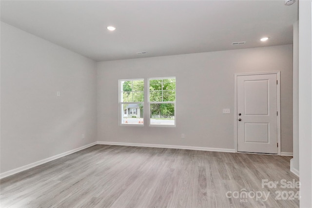 unfurnished room featuring light wood-type flooring