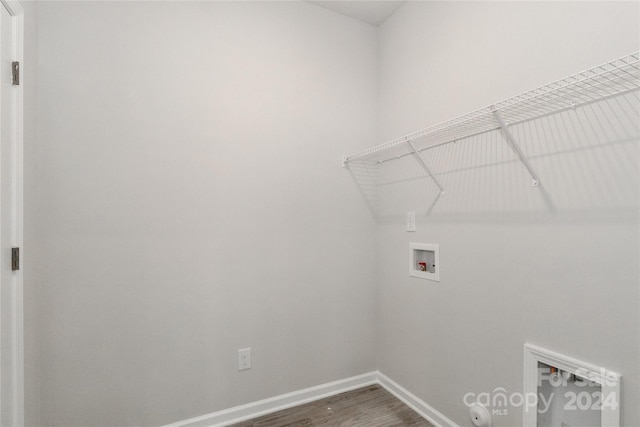 laundry area with washer hookup and hardwood / wood-style flooring