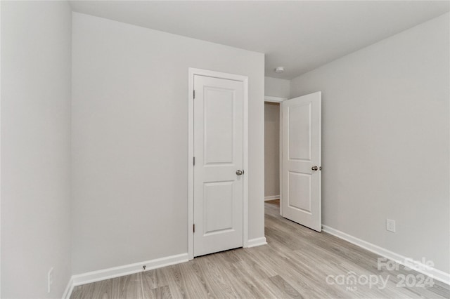 unfurnished bedroom with light hardwood / wood-style floors