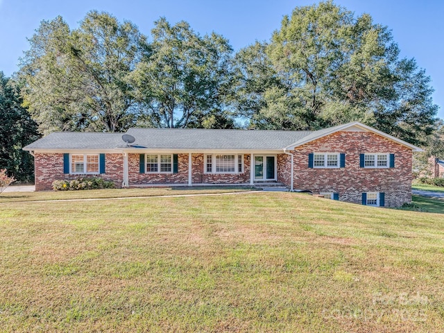 ranch-style house with a front lawn and cooling unit