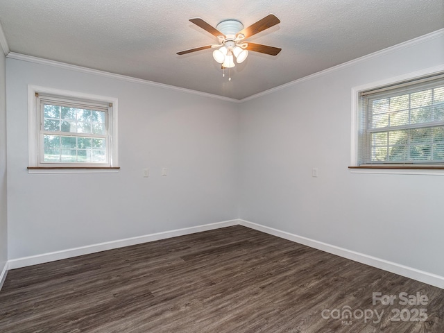 empty room featuring ceiling fan, ornamental molding, a textured ceiling, and dark wood-type flooring