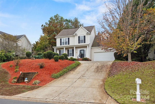 view of front property with a garage and covered porch