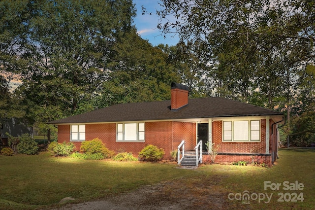 ranch-style house with a front yard