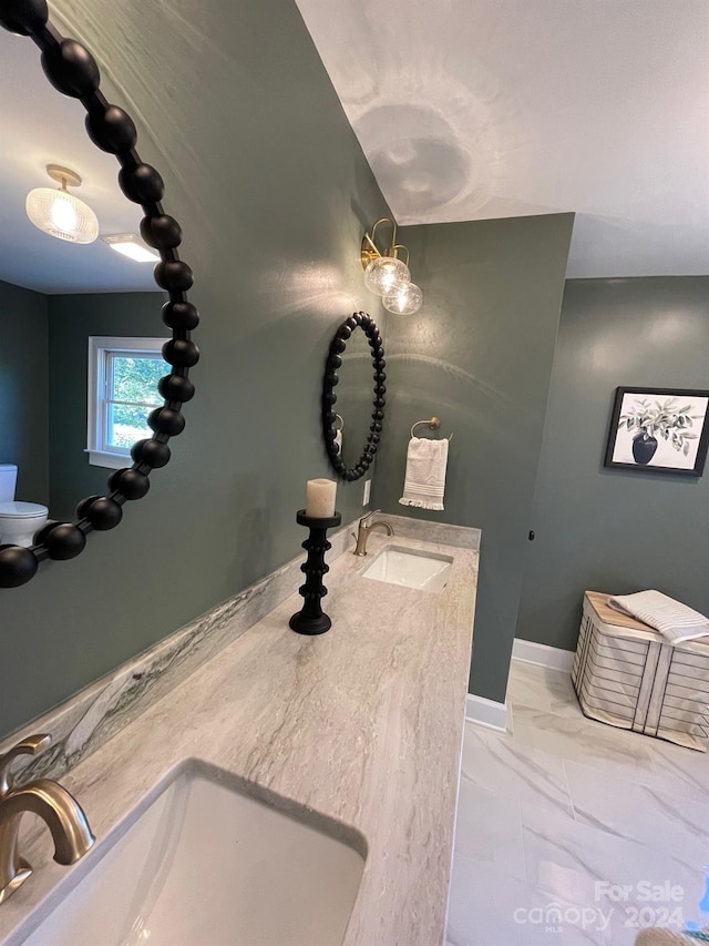 bathroom with vanity and toilet