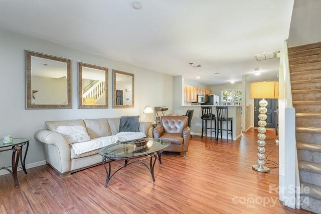 living room with light hardwood / wood-style floors