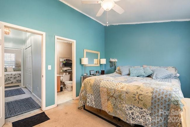 carpeted bedroom featuring ornamental molding, lofted ceiling, ceiling fan, and connected bathroom