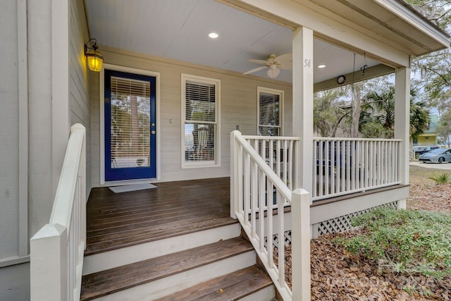 doorway to property featuring ceiling fan and a porch