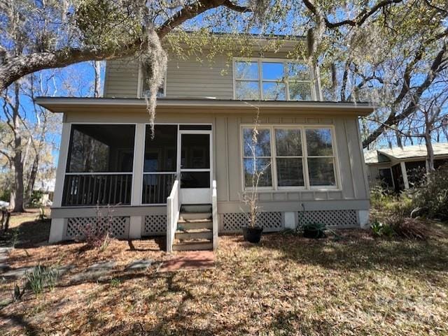 view of front of home featuring a sunroom