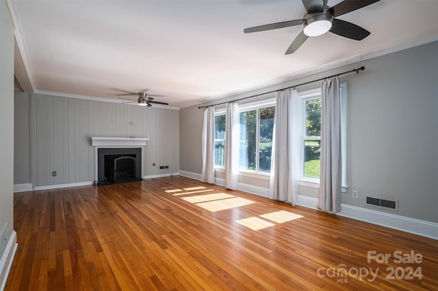 unfurnished living room with crown molding, ceiling fan, and hardwood / wood-style floors