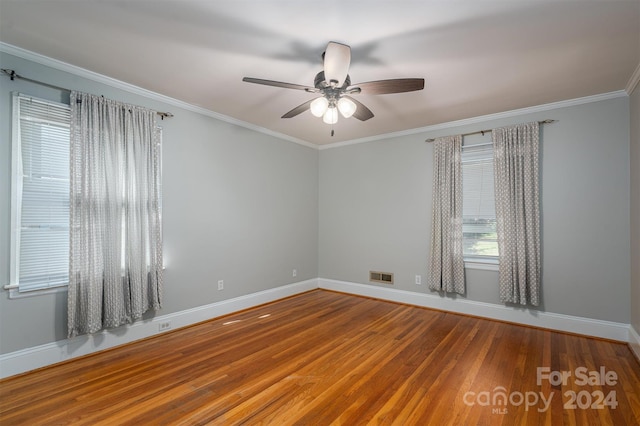 spare room with crown molding, ceiling fan, and hardwood / wood-style floors