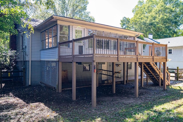 back of house featuring a deck