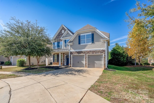 view of front of home featuring a front lawn and a garage