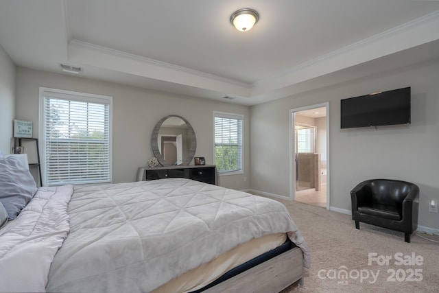 bedroom featuring carpet, connected bathroom, a raised ceiling, and multiple windows