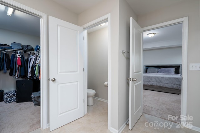 bathroom with tile patterned floors and toilet