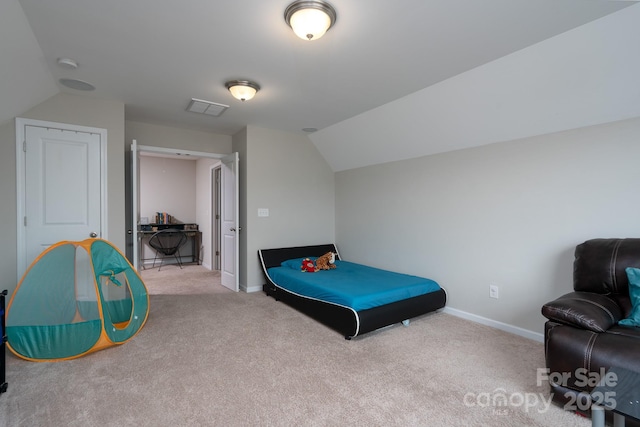 carpeted bedroom with lofted ceiling